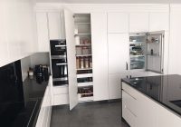 Black and white kitchen with integrated fridge